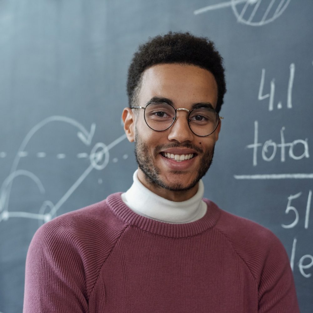 young-smiling-business-coach-in-eyeglasses-and-casualwear.jpg